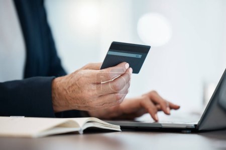 Photo for Hand, laptop and credit card with an accountant online making a payment from a desk in the office. Computer, accounting and finance with a business person shopping or making an ecommerce purchase. - Royalty Free Image