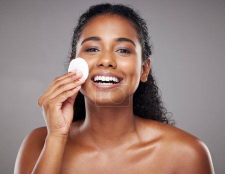 Photo for Skincare, beauty and portrait of black woman with cotton pad to cleanse face. Beauty products, facial and girl clean makeup, cosmetics and skincare products for healthy skin, wellness and body care. - Royalty Free Image