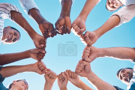 Photo for Fist bump, teamwork and business people in a team building meeting for collaboration, motivation and support. Global, below view and workers hands in a huddle startup for goals, targets and mission. - Royalty Free Image
