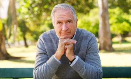Photo for Life itself has been a worthwhile journey. Cropped portrait of a senior man contemplating with his hands clasped at the park - Royalty Free Image