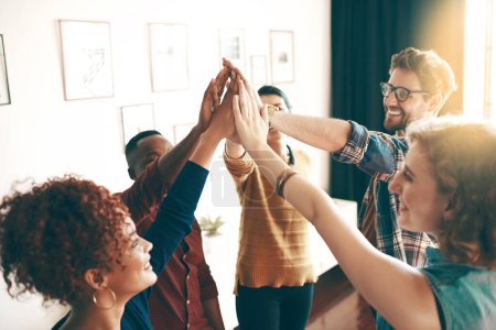 Photo for They just keep on winning. a group of designers high fiving together in an office - Royalty Free Image