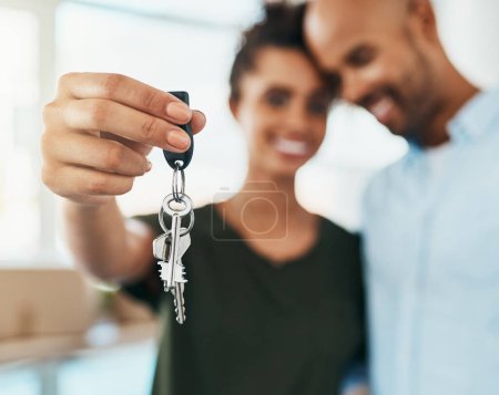 We found a new place to call home sweet home. Portrait of a young couple holding the keys to their new home Poster 619636508