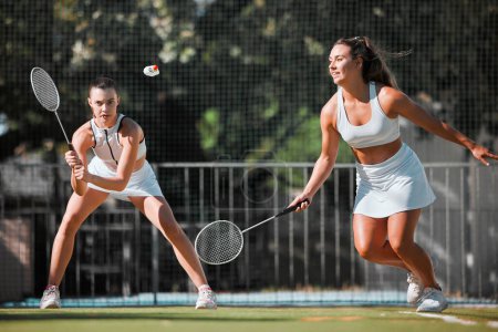 Photo for Fitness, team and women with tennis on tennis court, athlete playing game with focus and sport workout outdoor. Sports match, young and cardio while training and exercise together with teamwork - Royalty Free Image
