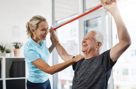 Photo for Youre doing great. a mature female physiotherapist working with a senior male patient in her office - Royalty Free Image