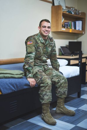 Photo for You saw Americas next hero here first. a young soldier sitting on his bed in the dorms of a military academy - Royalty Free Image