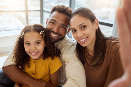Photo for Black family, selfie and happiness of a mother, father and girl bonding together at home. Portrait of a happy mama, dad and child with quality time, parents love and a hug showing care at a house. - Royalty Free Image