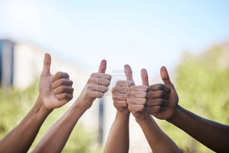 Photo for Diversity, hands and thumbs up in collaboration, teamwork or agreement in solidarity together in the outdoors. Group hand of people in yes, thank you or great gesture for community, trust and support. - Royalty Free Image