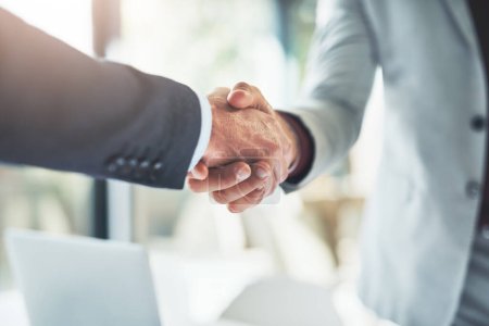 Photo for Well do great things together. two unrecognizable businessmen shaking hands after making a deal in the office - Royalty Free Image