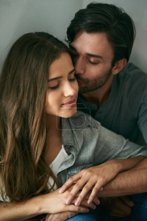 Photo for We have each other and thats all that matters. an affectionate young couple holding each other at home - Royalty Free Image