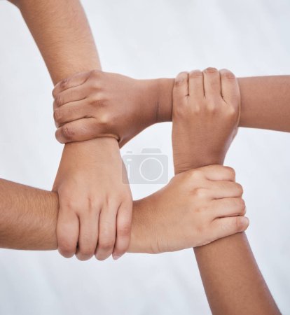 Photo for Hands, collaboration and joined people holding hands for unity, solidarity and connection. Community, support and teamwork with colleagues working together. Union, partnership and motivated people. - Royalty Free Image
