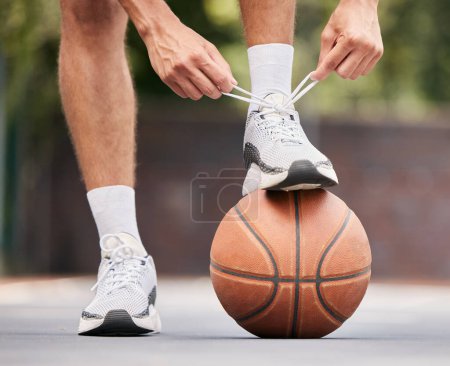 Photo for Basketball, athlete with shoelace, shoes and sport on basketball court outdoor, fitness and exercise motivation. Man, basketball player and ready for game, training and active with cardio and sports - Royalty Free Image