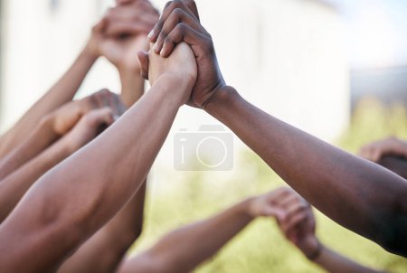 Photo for Diversity, holding hands and support with solidarity and prayer circle outdoor together. Group hands in air, motivation and team building for collaboration help, trust and friends hope for community - Royalty Free Image