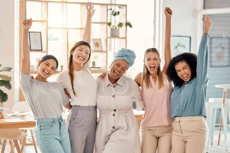 Photo for Empowerment, success and portrait of group of women celebrating achievement, win and victory in startup. Teamwork, diversity and businesswomen in celebration with hands in air in creative workspace. - Royalty Free Image