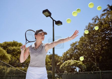Photo for Tennis, tennis ball and woman serving for fitness training, cardio workout and sports exercise outdoors in summer. Focus, action and healthy athlete serves multiple balls on a tennis court in a game. - Royalty Free Image