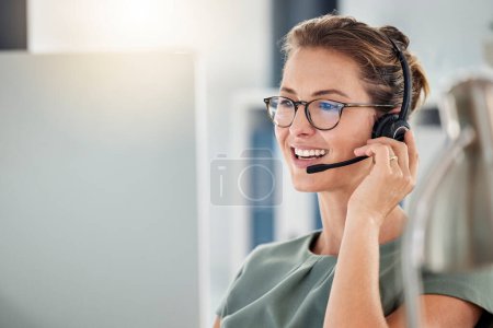 Happy call center woman consulting customer for customer support, help or telemarketing sales. Sales advisor, CRM girl with smile for success customer service, contact us hotline or insurance deal.