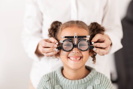 Photo for Vision, optometrist and portrait of child with glasses to test, check and examine eyesight. Healthcare, medical and young girl in doctor office for eye examination, optical diagnostic and examination. - Royalty Free Image
