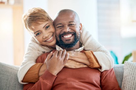 Photo for Marriage, couple and hug portrait at sofa with loyalty, happiness and care in home lounge. Love, black woman and black man relax in house living room together with happy smile and embrace - Royalty Free Image