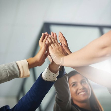 Photo for Well achieve success as a team. a group of businesspeople high fiving in an office - Royalty Free Image