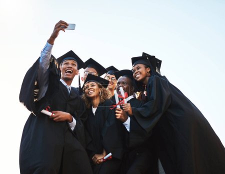 Photo for This one is for everyone who couldnt make it today. a group of students taking a selfie on graduation day - Royalty Free Image