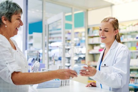 Photo for She wants whats best for her customers. a young pharmacist assisting a customer - Royalty Free Image