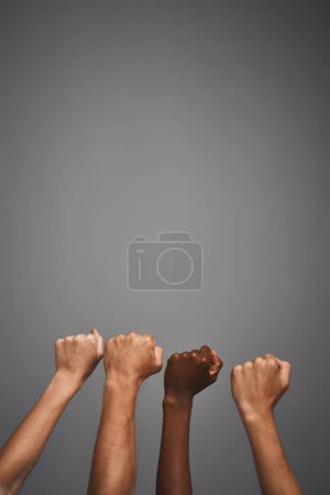 Photo for Fighting for whats right together. Studio shot of unidentifiable hands making fists against a gray background - Royalty Free Image