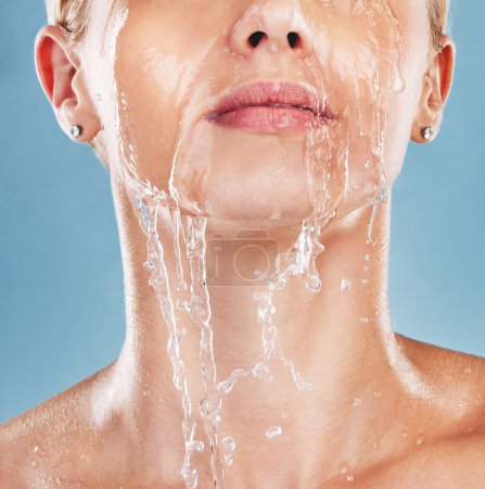 Photo for Woman face, water splash and cleaning skin, wellness and shower in blue studio mockup background. Mock up, model cosmetic and cleaning body with facial wash, clean and bath for hygiene and hydration. - Royalty Free Image