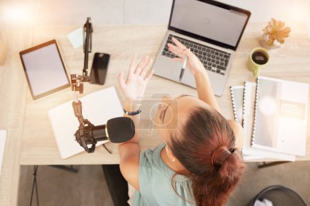 Photo for Top view, podcast microphone and woman on laptop recording audio for live streaming mockup. Presenter, host and female influencer on mic for talk show broadcast, radio or talking to online audience - Royalty Free Image
