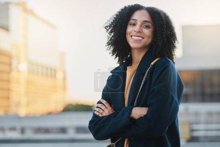 Photo for Black woman, city and smile portrait of a person by and urban building feeling relax and happy. Travel, freedom and happiness of a young female outdoor with a bag ready for traveling or work. - Royalty Free Image