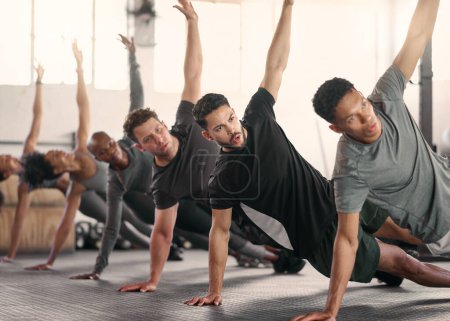 Teamwork, fitness or sport team stretching in gym, studio or arena floor for wellness, exercise or sports workout. Diversity, health or athlete group for warm up, motivation or cardio team building.