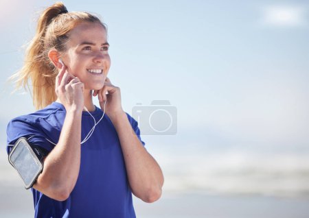 Photo for Earphones, runner and woman in nature with phone streaming audio, music or podcast mock up. Sports, fitness and female from Canada listening to song, radio or workout track after running or training. - Royalty Free Image