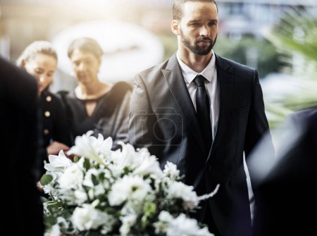 Photo for Death, funeral and carry coffin with family mourning, sad and depressed for grieving time. Grief together, mental health and man holding casket for church service, memorial and difficult for loss - Royalty Free Image