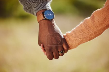 Photo for Parent, child and holding hands for care, love and support in trust, relationship and walk together in the park. Hand of father or mother with kid walking for family time and safety in the outdoors. - Royalty Free Image