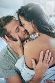You make me weak at the knees. a young couple sharing an intimate moment in their bedroom mug #620662470