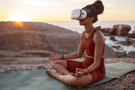 Photo for Woman, metaverse or vr headset in yoga meditation by beach, ocean waves, sea water in mental health support, zen app or 3d peace ai. Lotus, relax or wellness person on virtual reality chakra software. - Royalty Free Image