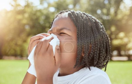 Photo for Covid, health and black kid blowing nose at park, nature or outdoors. Wellness, healthcare and sick girl child with tissue to wipe nose for virus, infection or cold, flu or covid 19, fever or allergy. - Royalty Free Image
