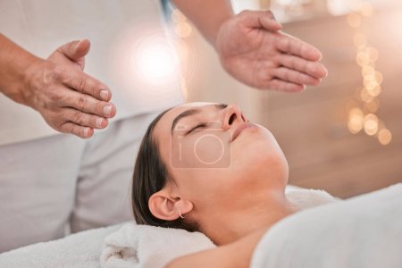 Woman, hands or relax reiki spa for stress management, headache relief or healthcare wellness in holistic clinic. Energy healer, man or mind chakra peace for sleeping patient and special effects glow.