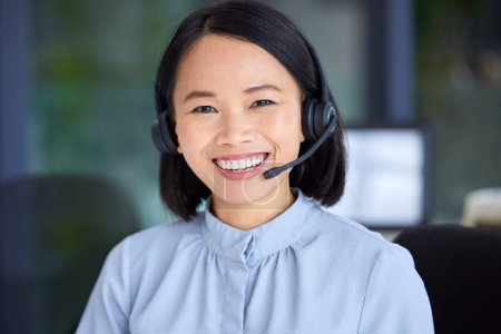 Portrait, call center and Asian woman for customer support, conversation and talking with smile, in office or happy. Client service, female agent and headset for telemarketing, speaking or consultant.