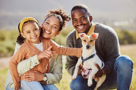 Photo for Family, portrait and dog at park with girl and parents relax, bond and play, happy and smile in nature. Black family, pet and having fun on a field, embrace and enjoy quality time with jack russell. - Royalty Free Image
