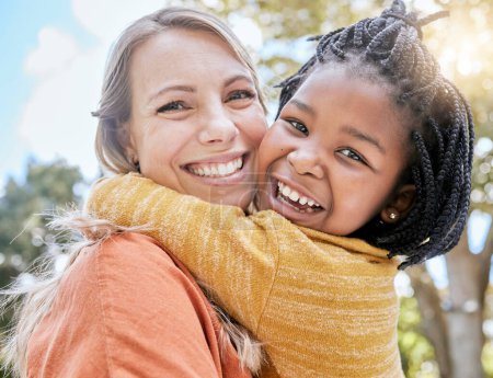Mom, child and interracial hug in park with smile, trees and sunshine in summer together for bonding. Mother, happy black child and outdoor embrace with love, care and diversity for happy family.