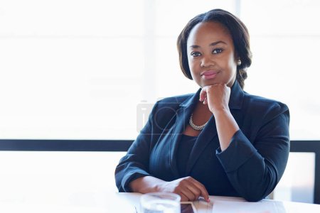 She believed she could, so she did. a businesswoman sitting in an office