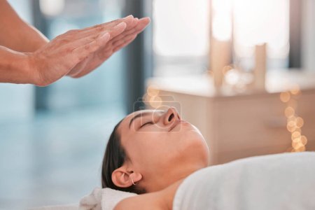 Hands, relax woman or reiki spa for headache pain relief, depression healing or stress management in healthcare wellness or holistic clinic. Man, energy healer or mind chakra aura cleanse on patient.