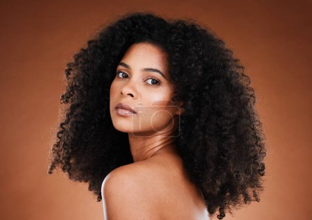 Photo for Model, black woman and afro hair with beauty, makeup and wellness in aesthetic portrait for cosmetic self care. Woman, hair care and cosmetics face with natural curly hair against studio background. - Royalty Free Image