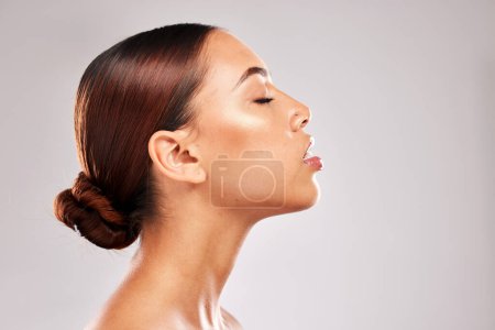 Photo for Skincare, woman and cosmetics for natural beauty, wellness and pride against studio background. Makeup young female and girl confident, healthy and with organic facial for wellness and smooth skin - Royalty Free Image