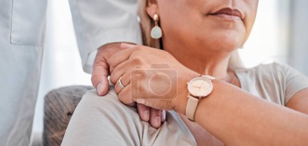 Mature woman, doctor and holding hands in support, trust and empathy in hospital clinic with chronic, terminal or cancer diagnosis. Zoom, healthcare worker and woman in comfort for mental health help.