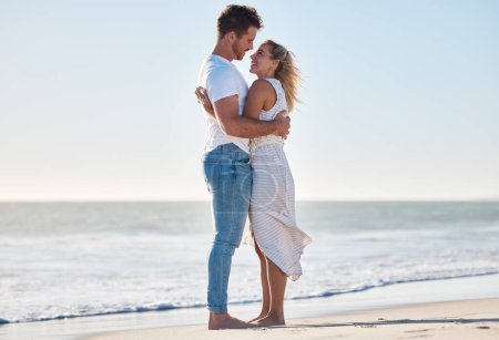 Photo for Hug, beach and happy couple on a romantic vacation for love together by the ocean in Australia. Travel, romance and young man and woman embracing while on a seaside honeymoon holiday or adventure - Royalty Free Image