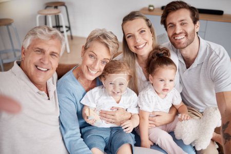 Selfie, family and children with grandparents, parents and girl siblings taking a photograph in a living room together. Kids, portrait and happy with a man, woman and daughter posing for a picture.