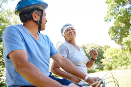 Photo for Healthy equals happy. a happy senior couple going for a bike ride and a jog together outdoors - Royalty Free Image