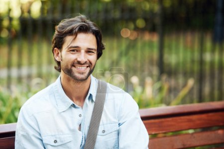 Photo for Fresh air always help. a handsome young man in the park - Royalty Free Image