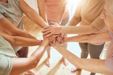 Photo for Senior woman, hands together and teamwork in gym for support, collaboration and fitness friends or people. Group hand, exercise team and elderly women with goal, target and success with community. - Royalty Free Image