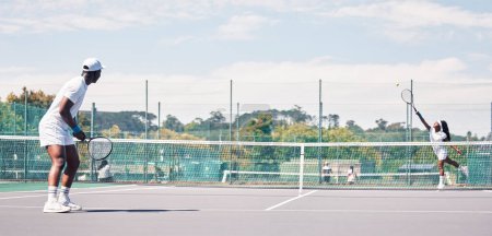 Photo for Fitness, tennis and people on tennis court, athlete playing game with focus and sport workout outdoor. Sports match, young man, woman and cardio while training and exercise together with teamwork. - Royalty Free Image